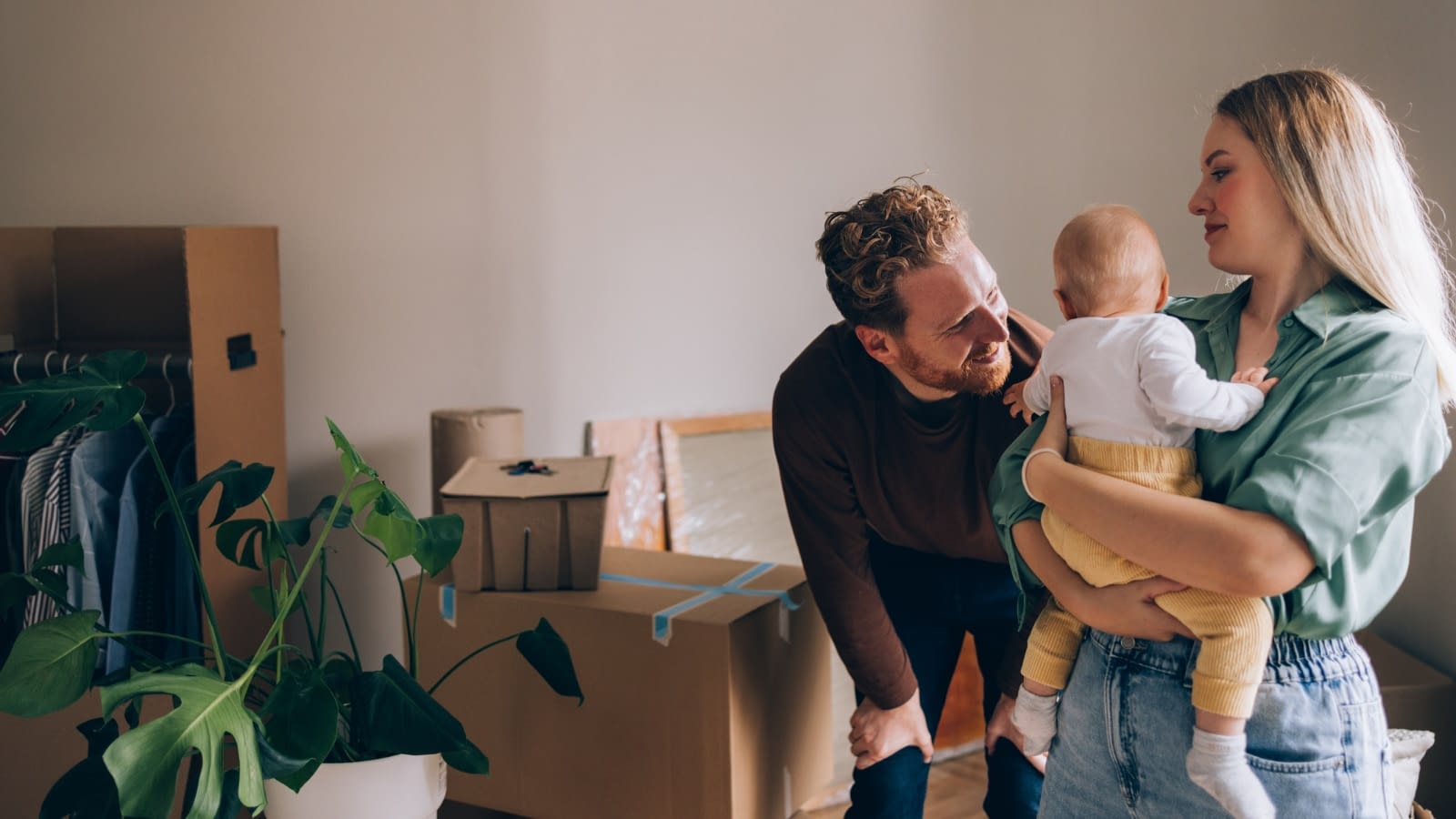 Young family spending time together with new baby.