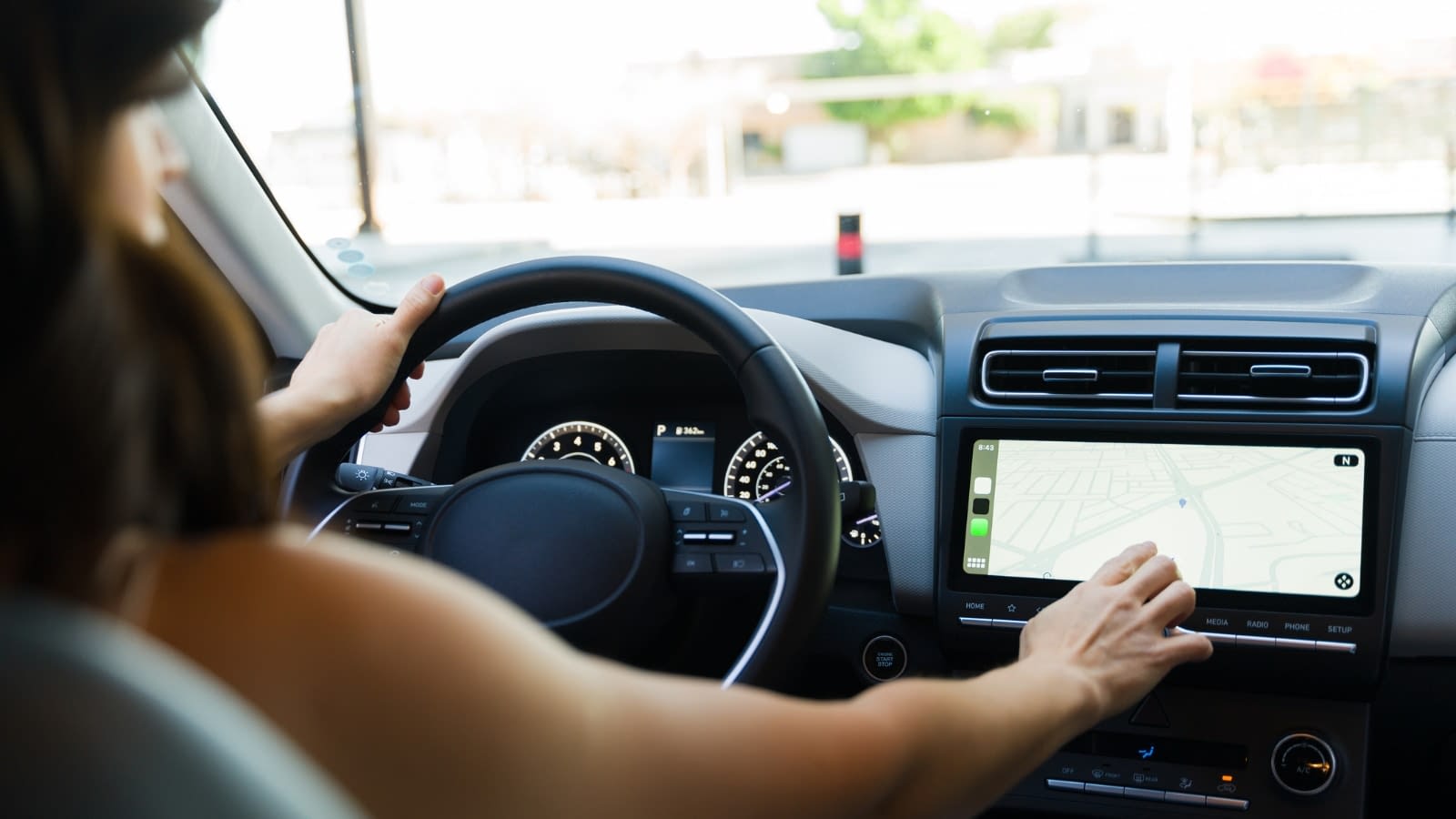 Woman using gps in car