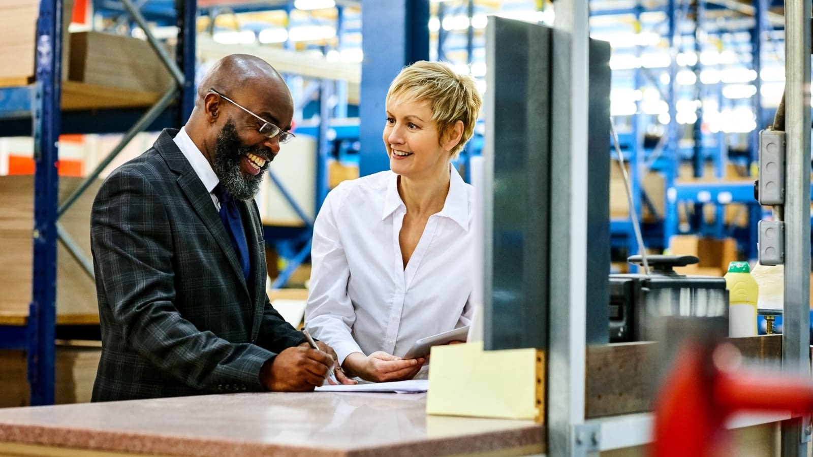 Business owner discussing something with female co-owner.