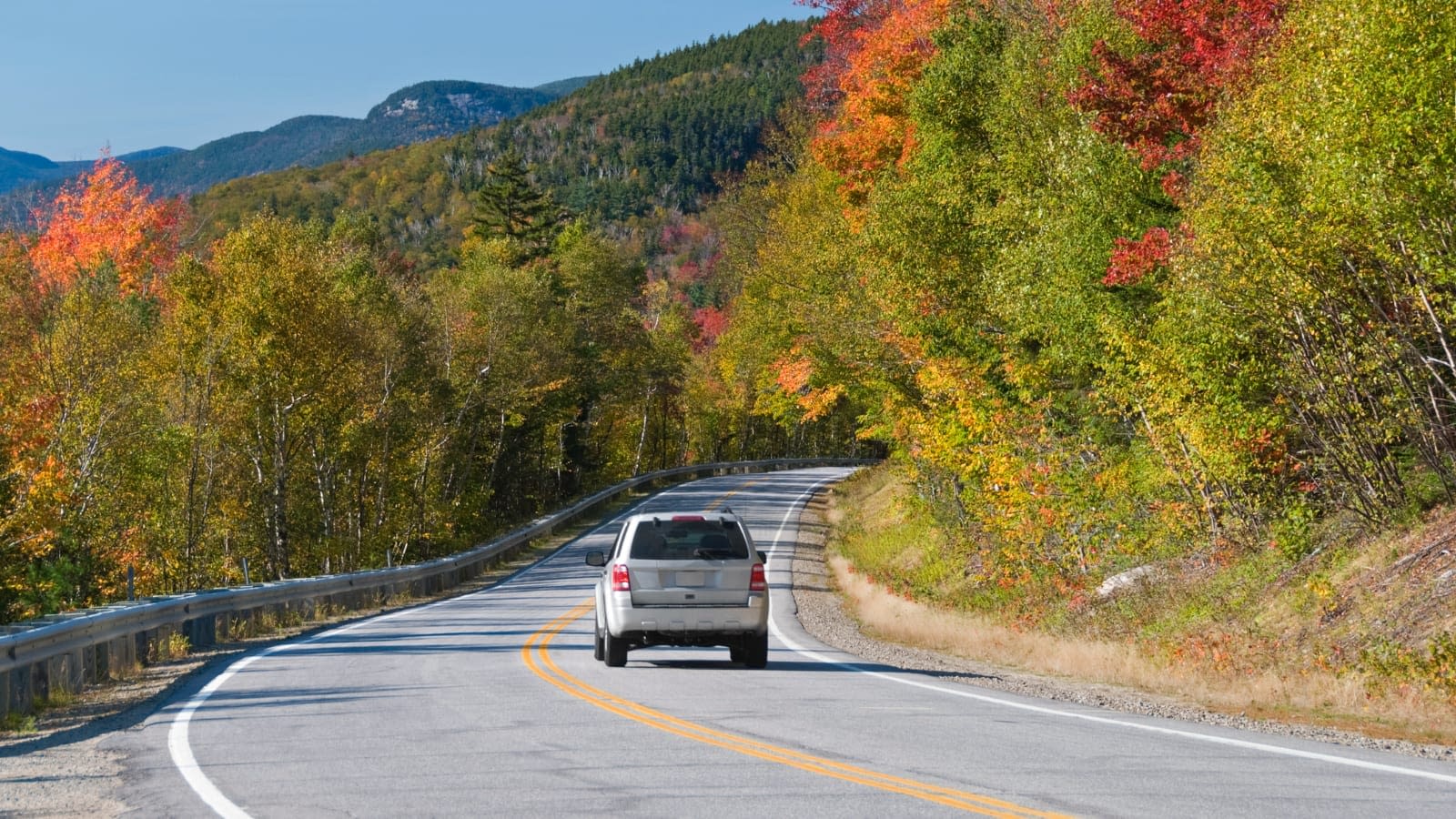car driving on country road during autumn