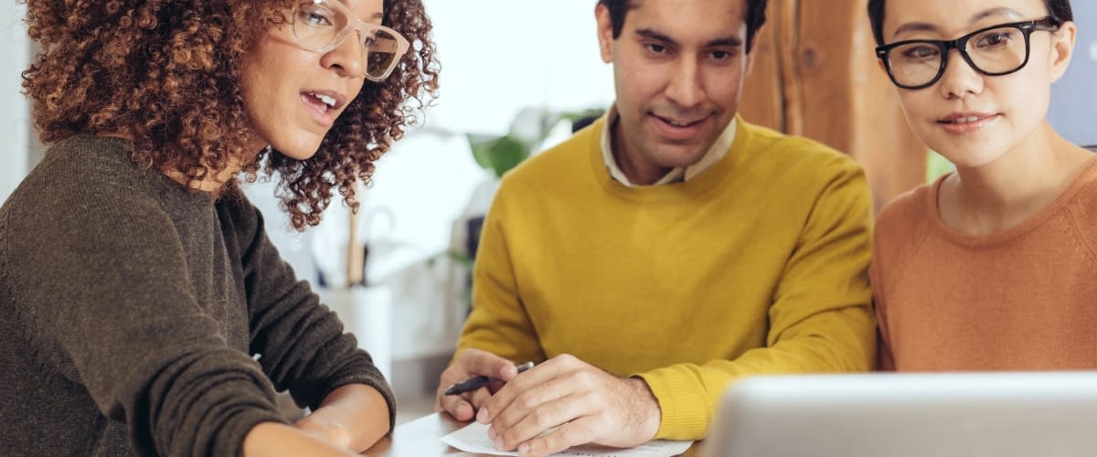 Couple discussing insurance with independent agent.
