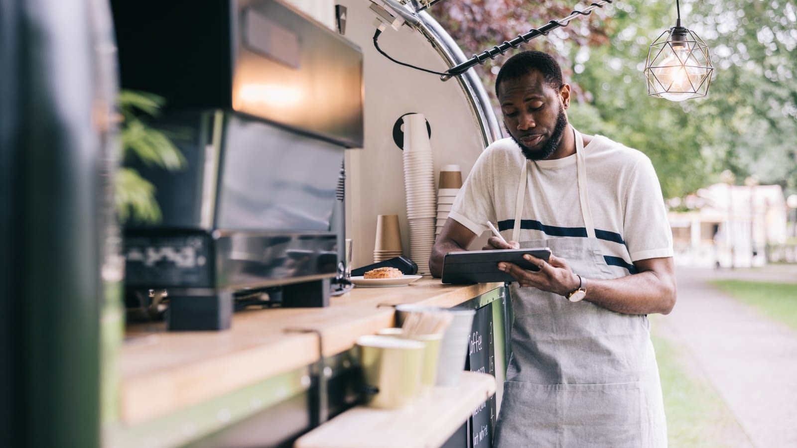 Young food truck owner at work