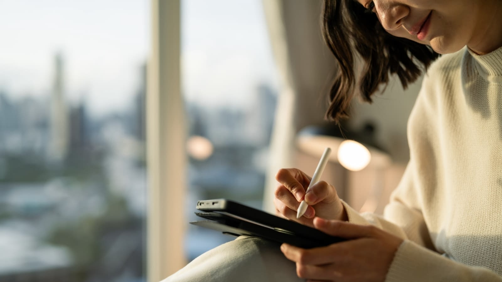woman reading insurance information on ipad