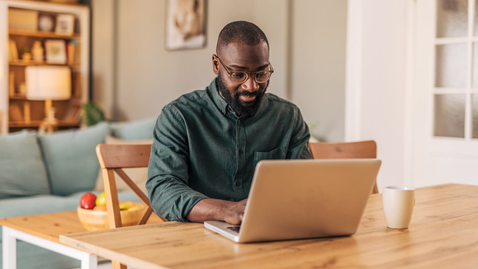 Young man reading about freelancer's insurance