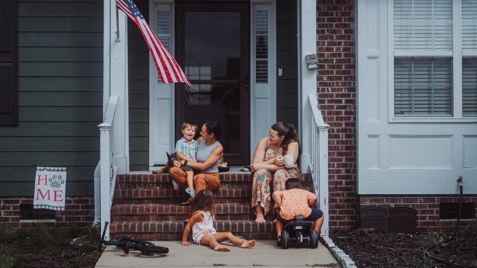 family sitting on porch