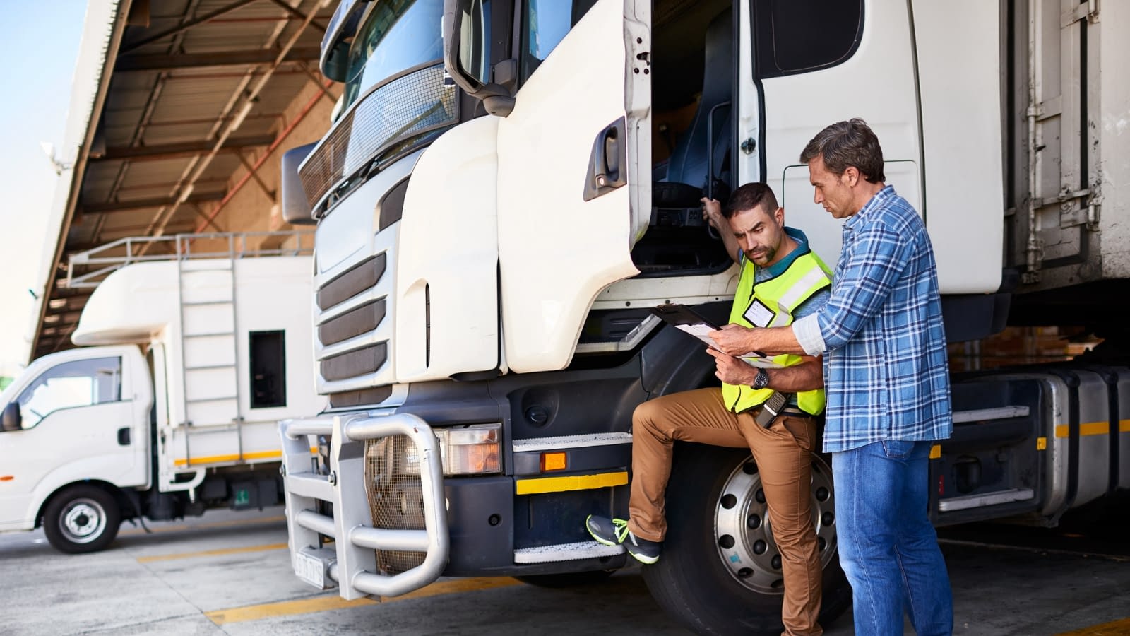 Truck drivers reviewing inventory